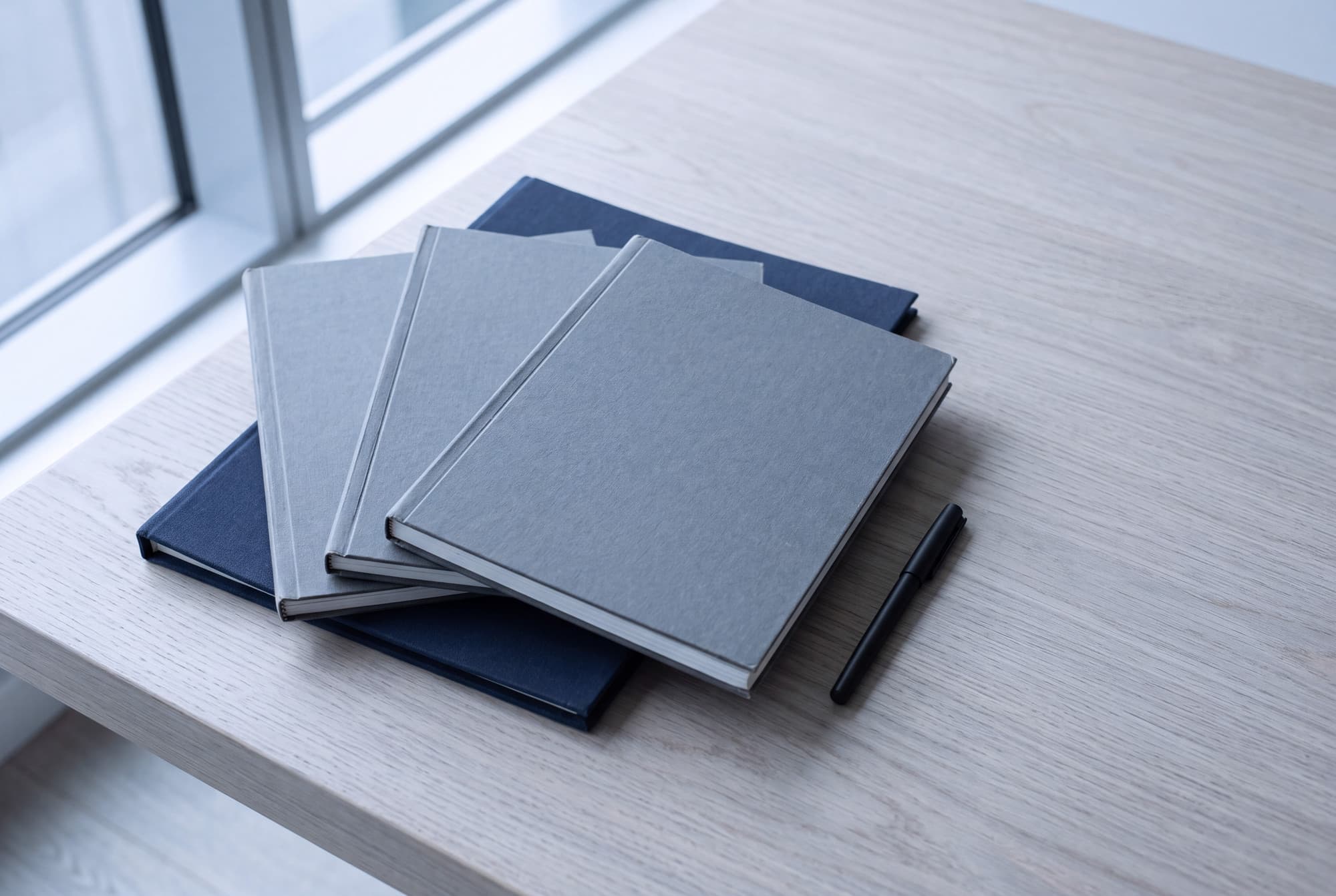 Closed document files squared on a desk in cool daylight